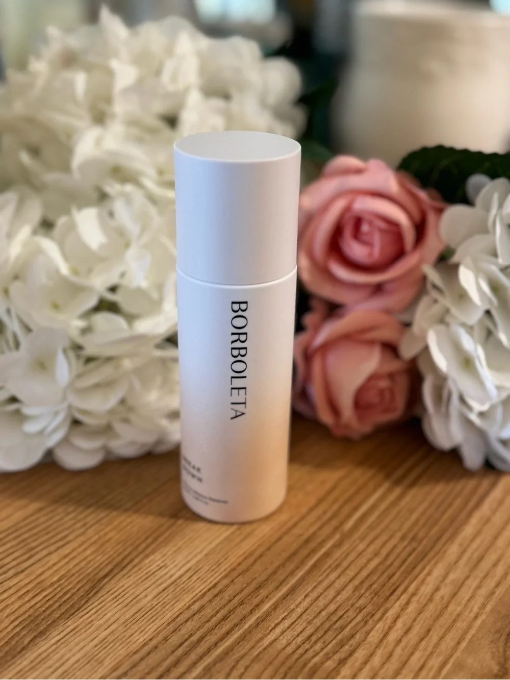 BORBOLETA White Skincare Bottle with Soft Pink Accents